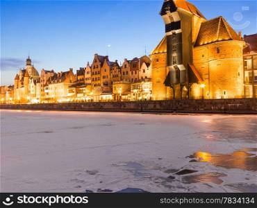 Old Town of Gdansk (Danzig) Poland Europe with Motlawa river and the Crane (Polish: Zuraw) symbol of Danzig. Winter night scenery