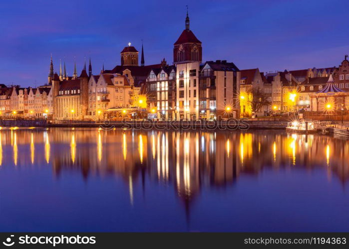 Old Town of Gdansk, Dlugie Pobrzeze, Bazylika Mariacka or St Mary Church, City hall and Motlawa River at night, Poland. Old Town and Motlawa River in Gdansk, Poland