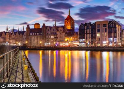 Old Town of Gdansk, Dlugie Pobrzeze, Bazylika Mariacka or St Mary Church, City hall and Motlawa River at sunset, Poland. Old Town and Motlawa River in Gdansk, Poland