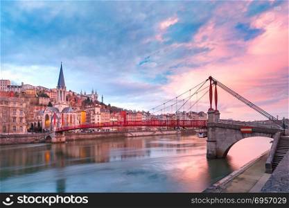 Old town of Lyon at gorgeous sunset, France. Saint Georges church and footbridge across Saone river, Old town with Fourviere cathedral at gorgeous sunset in Lyon, France