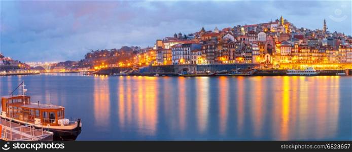 Old town of Porto during blue hour, Portugal.. Ribeira and Old town of Porto with mirror reflections in the Douro River during evening blue hour, Portugal, Portugal.