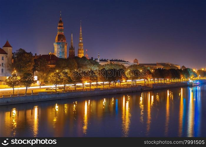 Old Town of Riga and River Daugava at night, Riga Cathedral and Saint Peter church, Railway Bridge and Riga Radio and TV Tower in the background, Latvia