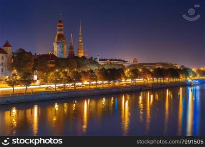 Old Town of Riga and River Daugava at night, Riga Cathedral and Saint Peter church, Railway Bridge and Riga Radio and TV Tower in the background, Latvia