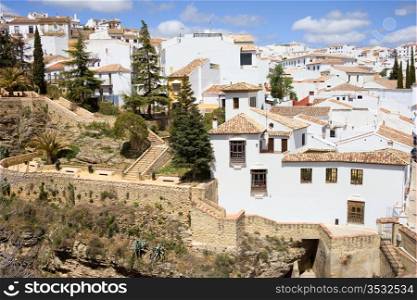 Old Town of Ronda historic architecture in Andalusia region, traditional Pueblo Blanco on a hill in southern Spain.