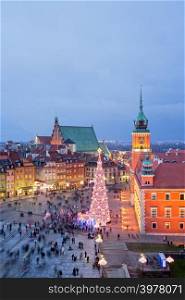 Old Town of Warsaw in Poland illuminated at evening, during Christmas time, composition with free space.
