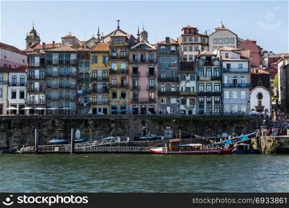 Old Town Skyline from Across the Douro River: Typical Colorful Facades - Porto, Portugal. Colorful Facades of Typical Houses on the Bank of the River Dour
