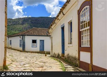 Old town street with historic colonial style houses in the city of Tiradentes in the interior of the state of Minas Gerais, Brazil. Old town street with historic colonial style houses in the city of Tiradentes