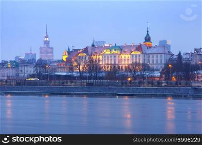 Old Town with reflection in the Vistula River during evening blue hour, Warsaw, Poland.. Old Town and river Vistula at night in Warsaw, Poland.