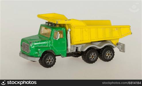 Old toy car (1970) isolated on a white background