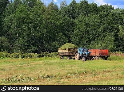 old tractor on summer field