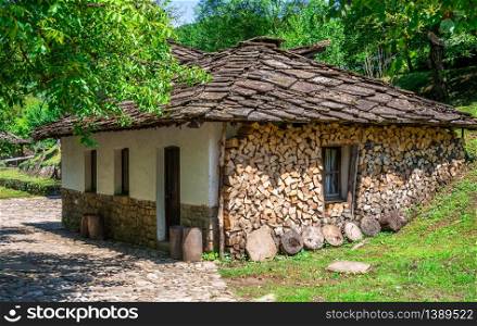 Old traditional house in the Etar Architectural Ethnographic Complex in Bulgaria on a sunny summer day. Etar Architectural Ethnographic Complex in Bulgaria