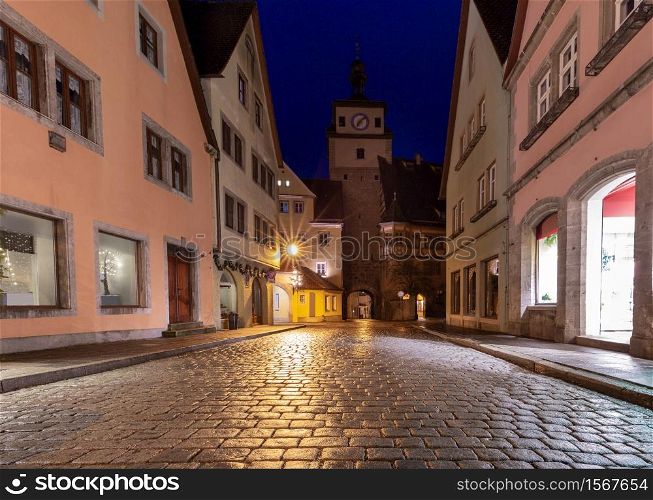 Old traditional medieval street in night illumination. Rothenburg ob der Tauber. Bavaria Germany.. Rothenburg ob der Tauber. Old famous medieval city.