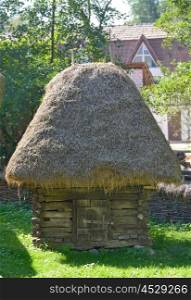 Old traditional romanian barn with straw roof