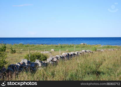 Old traditional stone wall at the swedish island Oland by the coast of the Baltic Sea