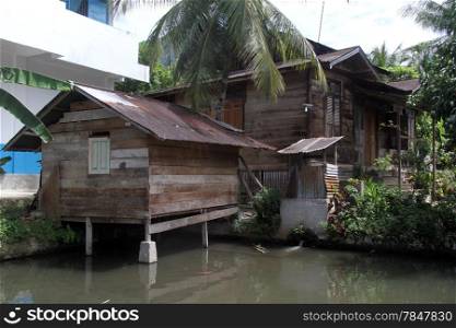 Old traditional wooden house on the lake Maninjau, Indonesia
