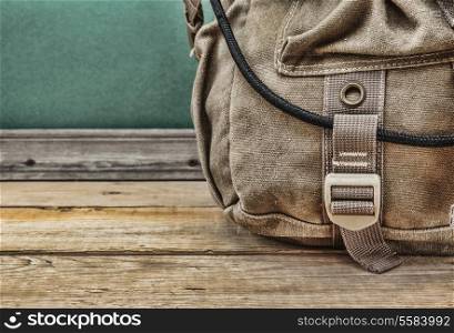 old travel backpack on the floor