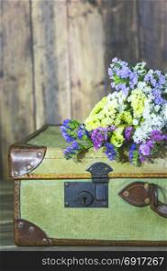 Old travel bag with delicate flowers