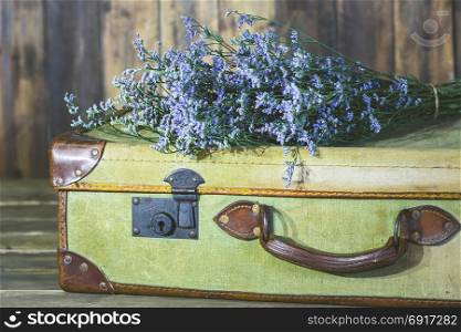 Old travel bag with delicate flowers