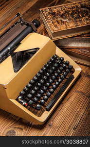 old typewriter, a pile of books and a lot of creativity. old typewriter, a pile of books and a lot of creativity!
