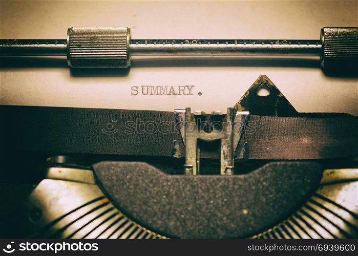 Old typewriter, with the written word. Summary