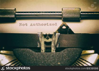 Old typewriter, with the written word Unauthorized