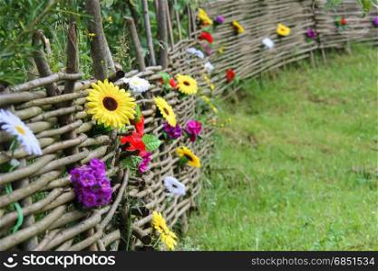 Old Ukrainian style fence with decorative flowers