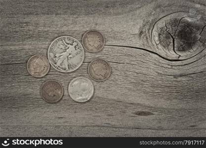 Old United States coins on rustic wood with vintage concept. Layout in horizontal format.