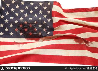 old USA flag stained with blood