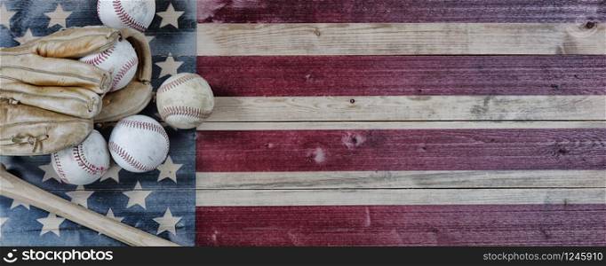 Old used baseballs, bat and glove on vintage United States wooden flag background. Baseball sports concept with copy space