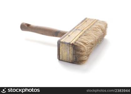 Old used paintbrush tool isolated on white background. Construction paint brush for house room renovation