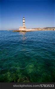 Old Venetian lighthouse on Hania port, Crete island, Greece