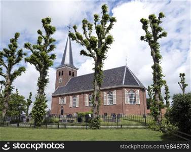 old village church of Reduzum in the countryside between Leeuwarden and Sneek in dutch province of Friesland in the Netherlands