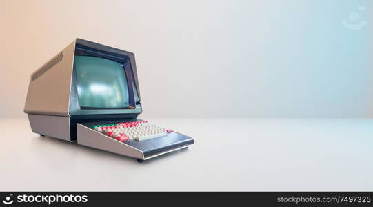 Old vintage and style computer on white wall background .