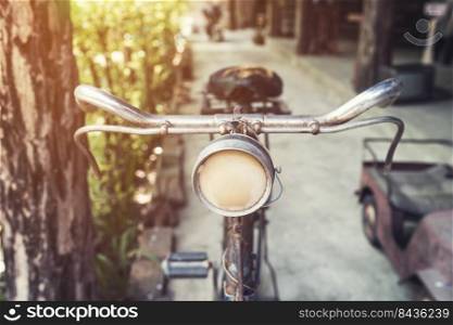 old vintage bicycle and light in garden