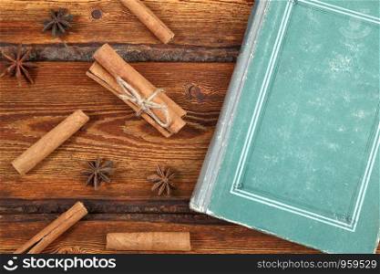 old vintage book on dark wooden background . top view. flat lay
