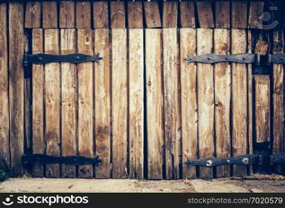 Old vintage grunge door made from old wooden planks. Background.. Old wooden vintage grunge door