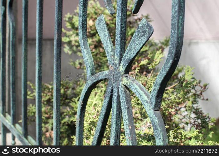 Old vintage iron fence decorative element closeup