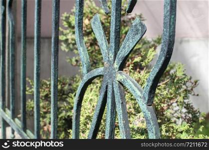 Old vintage iron fence decorative element closeup