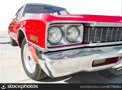 Old vintage retro car. Red color american car. White isolated