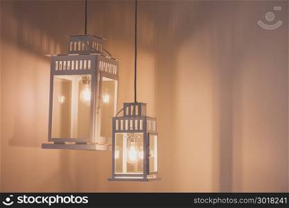 Old vintage style lamps over blank wall