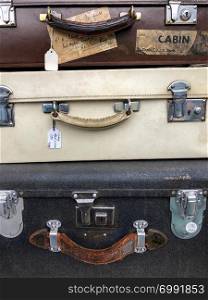 Old vintage suitcases for sale on a market in London, England.