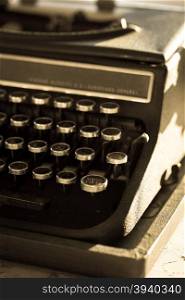 Old vintage typewriter under the evening lights