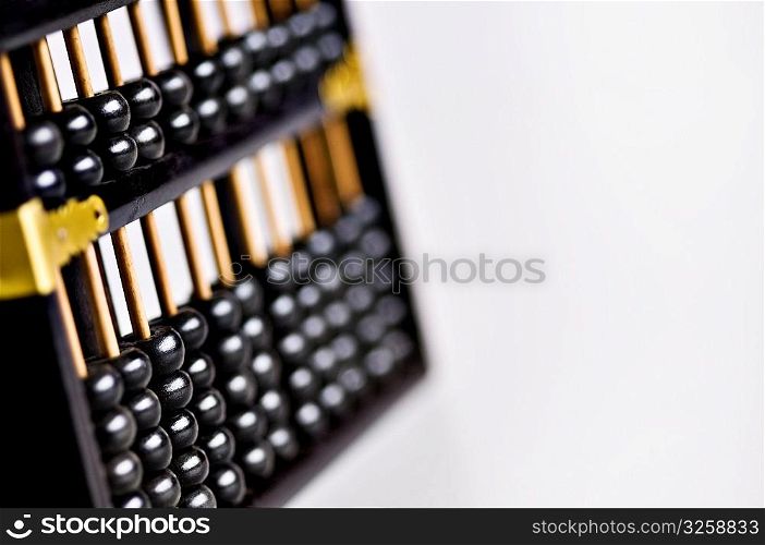 Old vintage wooden abacus on white background.
