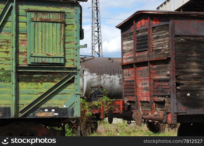 Old vintage wooden railway wagons and cistern