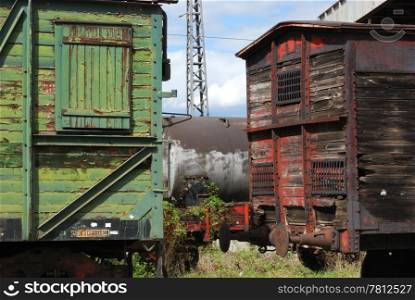 Old vintage wooden railway wagons and cistern