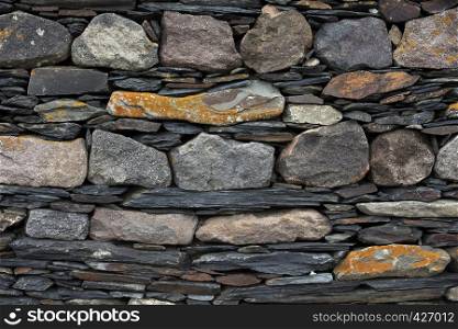 old wall built of different stones