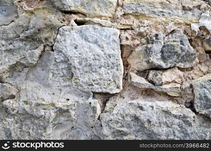 Old wall, built of rough stones of various sizes
