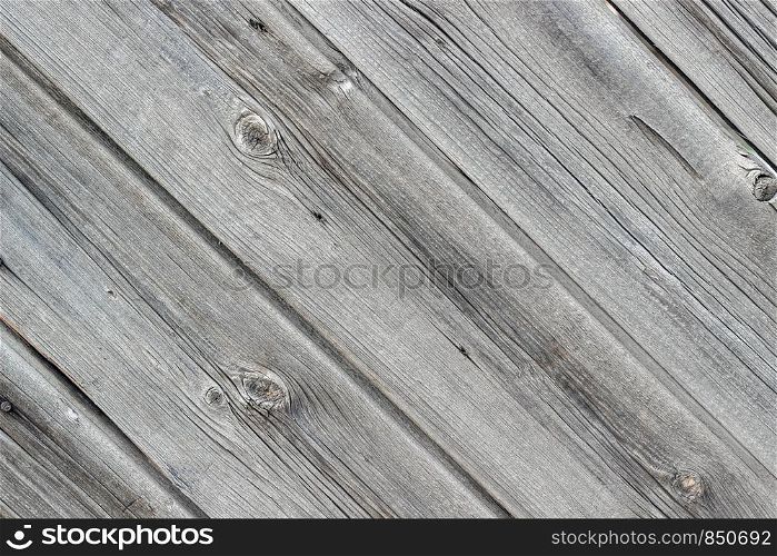 Old wall made from wooden panels as a background or texture. Diagonal layout, the texture of the wood.