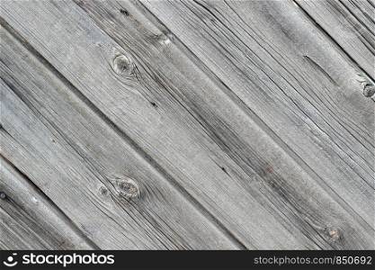 Old wall made from wooden panels as a background or texture. Diagonal layout, the texture of the wood.