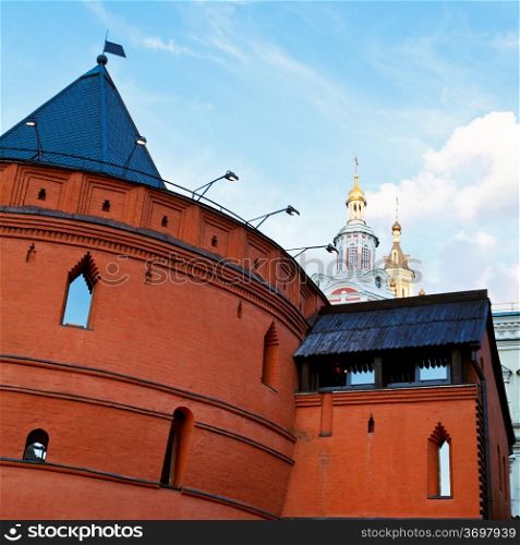 old wall of historical Kitay-gorod and towers of Zaikonospassky monastery in Moscow